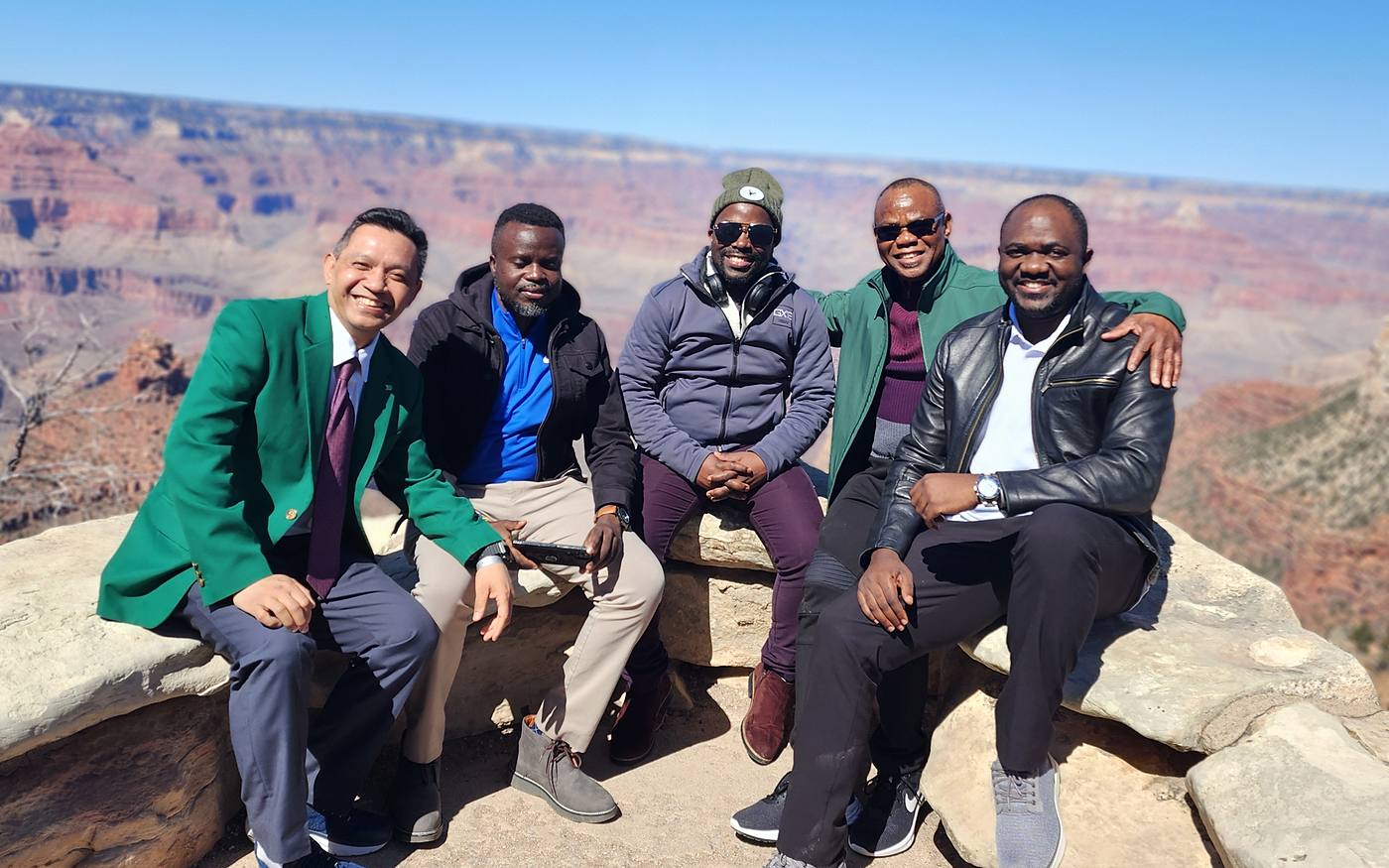 SEEDS team sitting together at the Grand Canyon rim