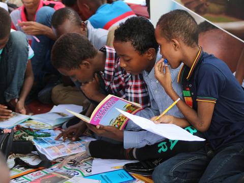 Children reading books together