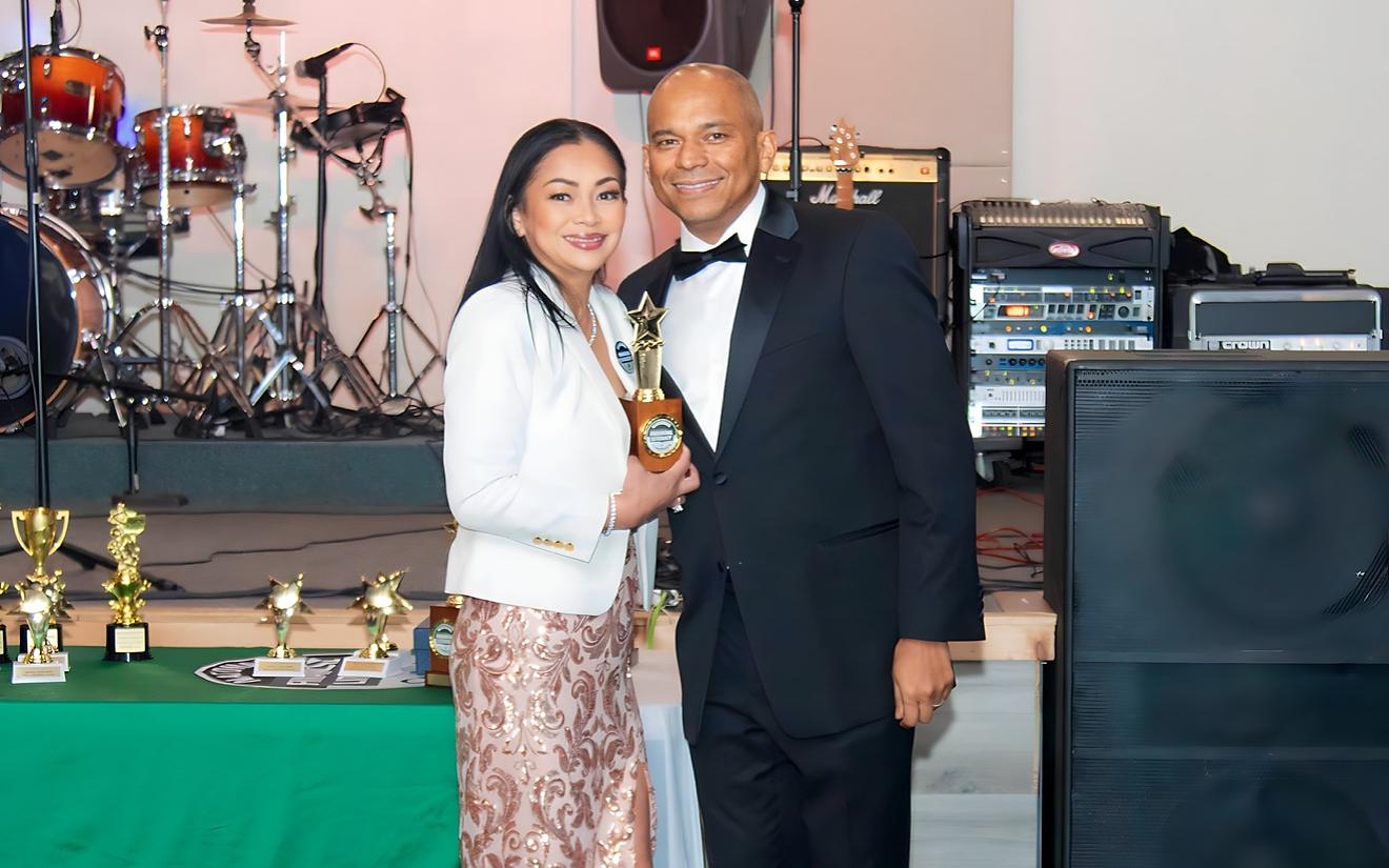 SEEDS leaders with an award at the gala