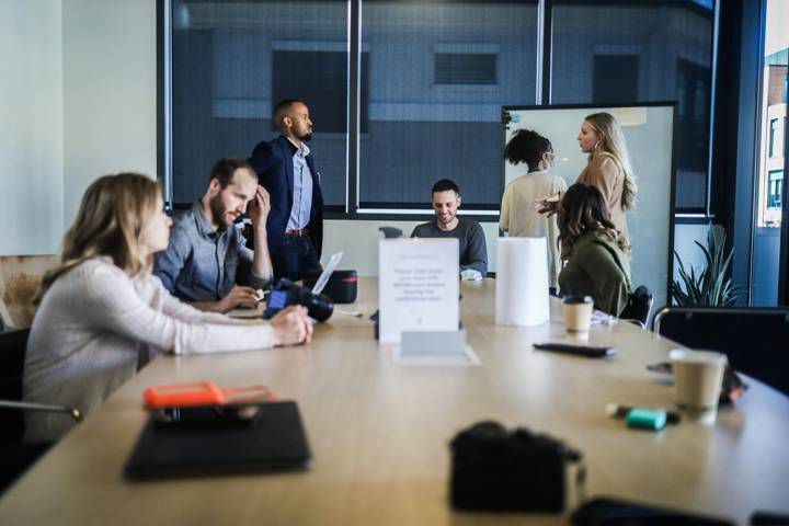 A team working on strategy at a whiteboard