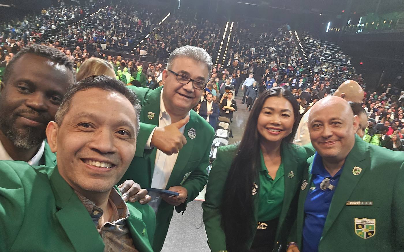 SEEDS leaders in green jackets at a national convention