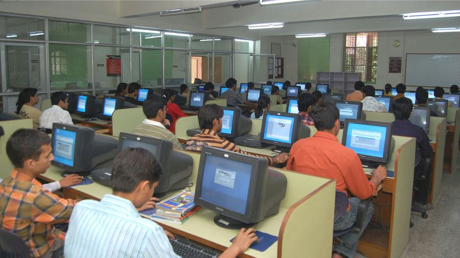 Students practicing in a computer lab